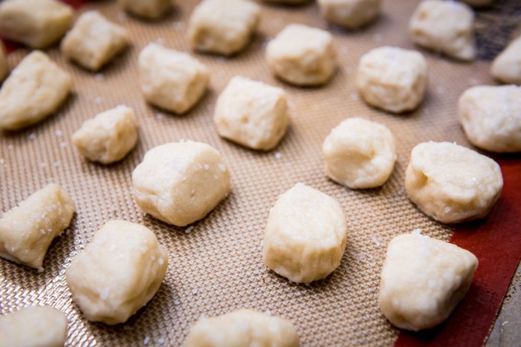 Soft pretzel bites boiled and ready for the oven